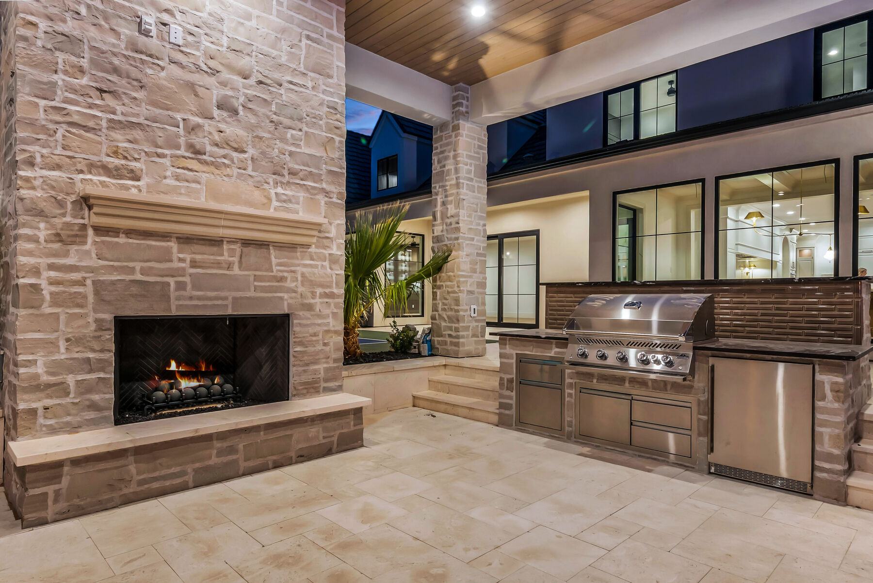Outdoor kitchen and fireplace by Paragon Pools — St. George, Utah